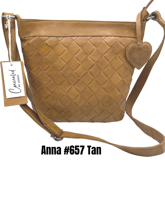 Concealed and carry handbag genuine leather handdmade. Tan color  handwoven basket weave design on front.  Smooth backside with two locking YKK zippers for both left handed and right handed entry Heart shaped leather purse charm .
