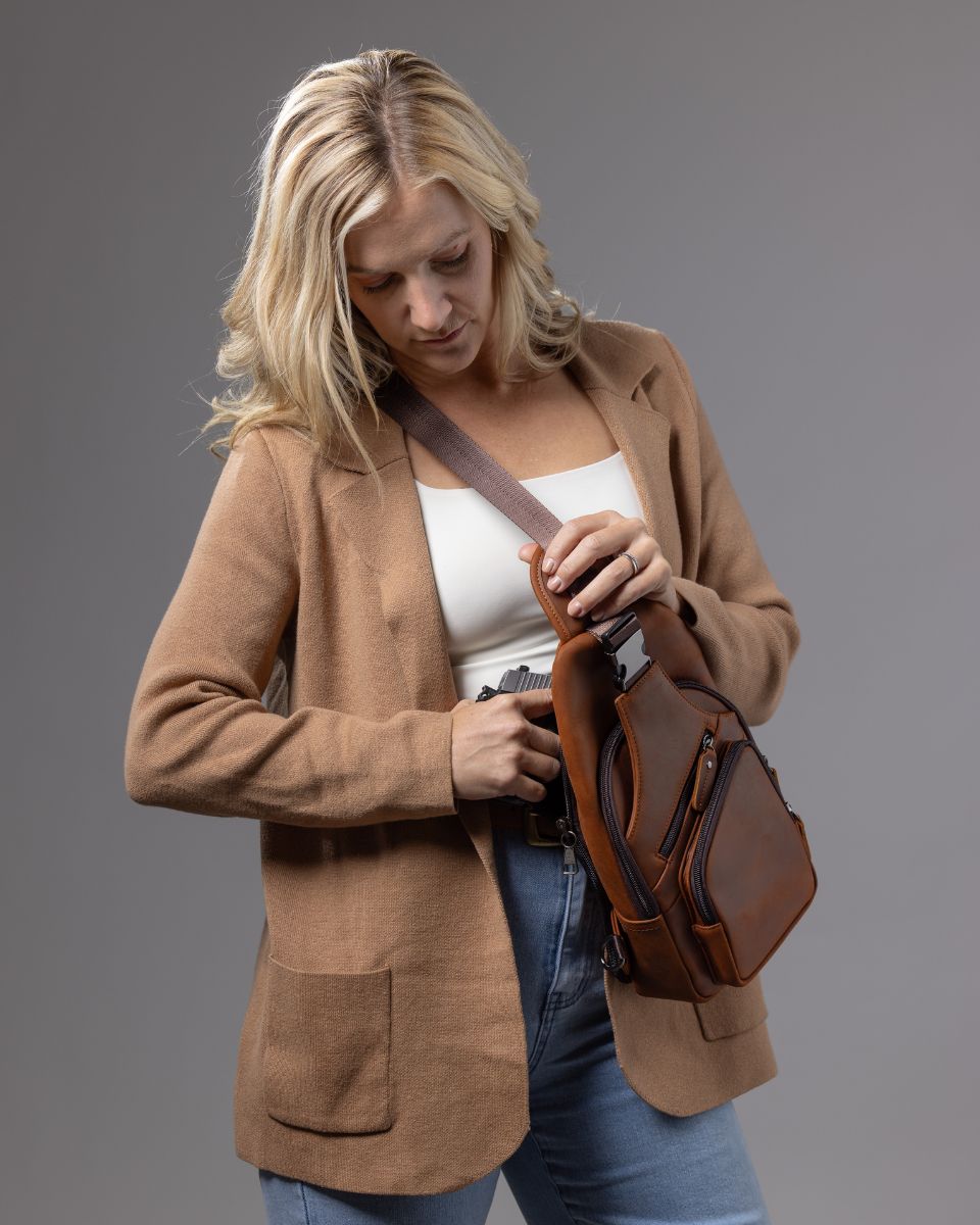 Concealed Carry Xander Leather Sling in Distressed Brown – worn by model 3