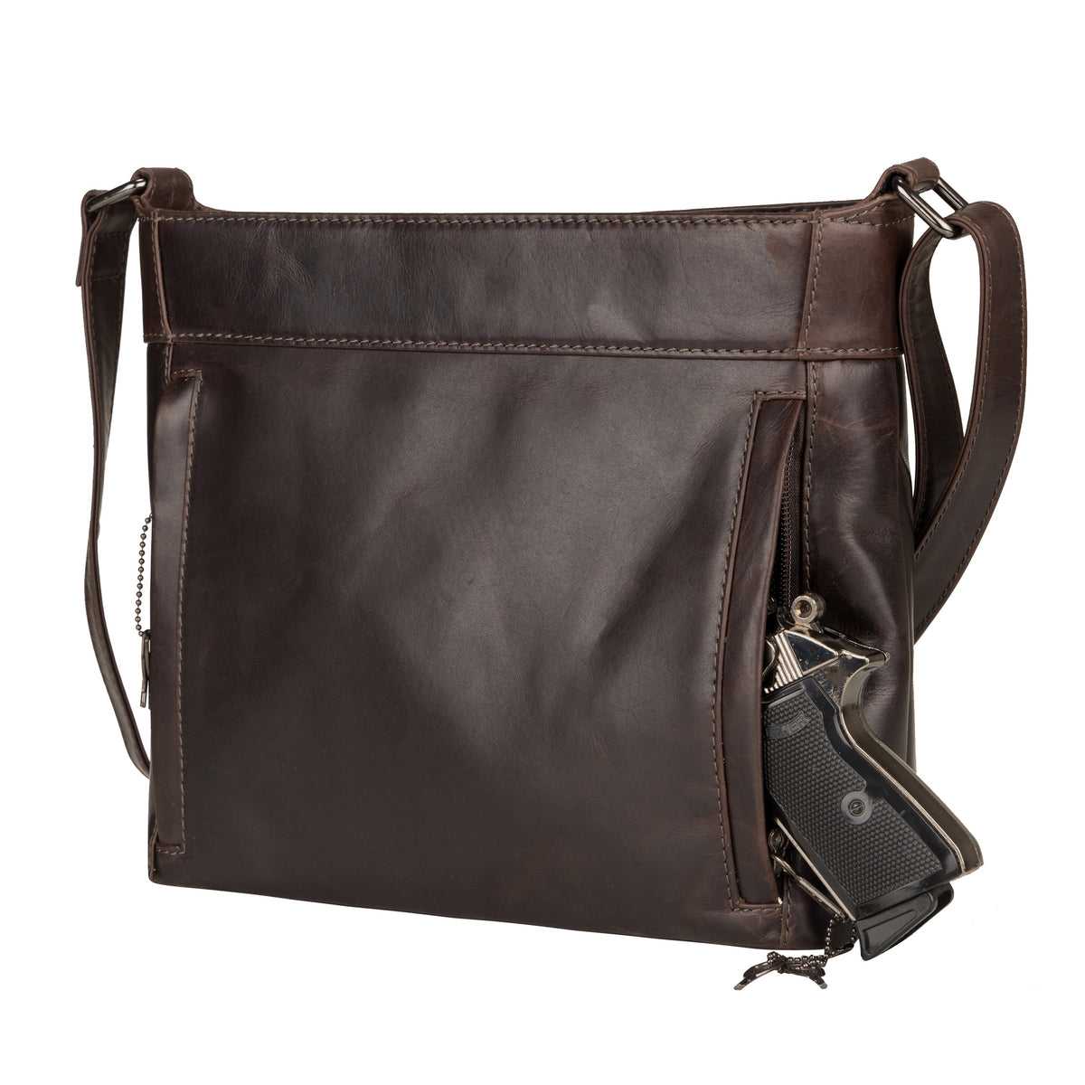 Delaney Concealed Carry Crossbody in Dark Mahogany – shown with handgun