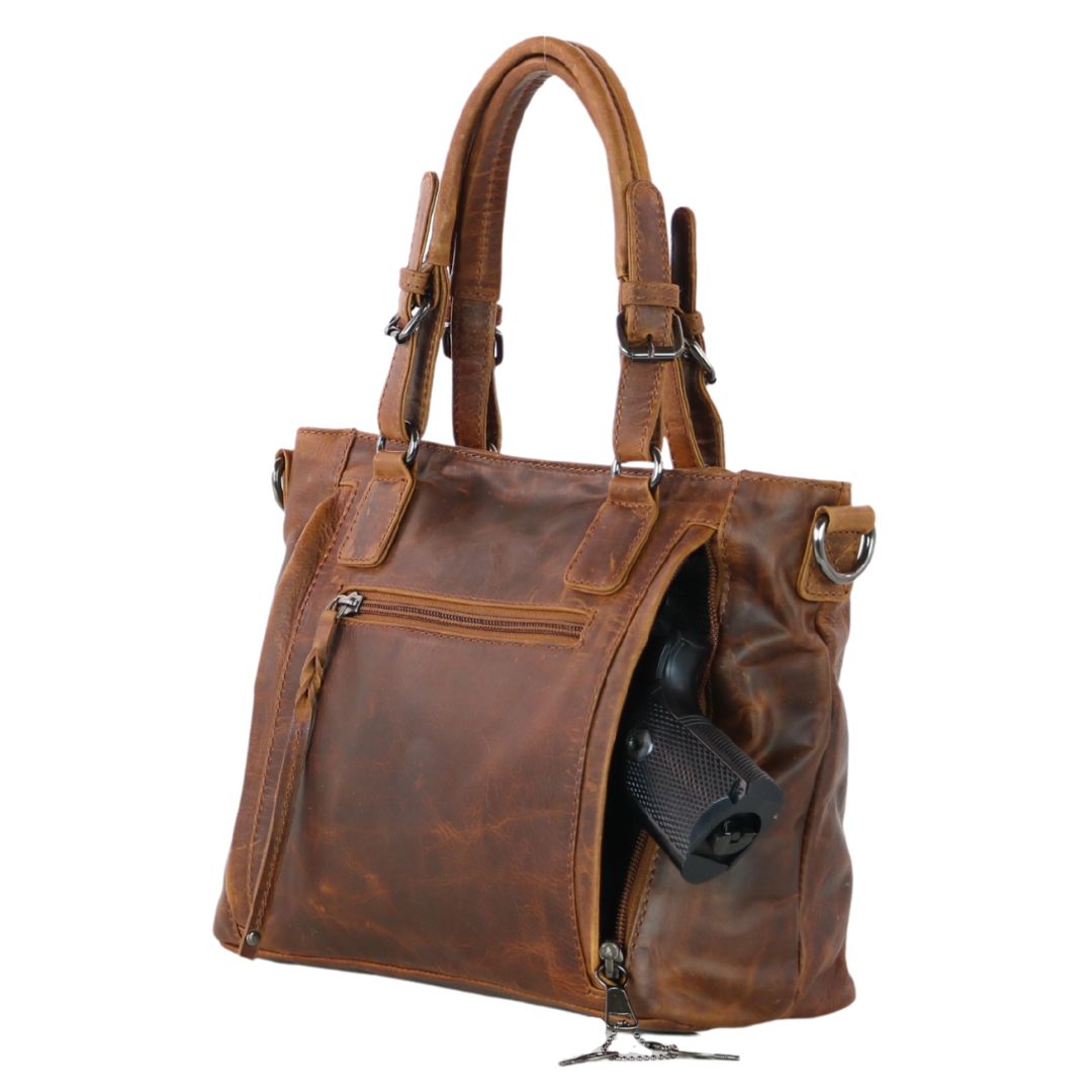 Concealed Carry Bailey Leather Satchel in Cognac – shown with handgun