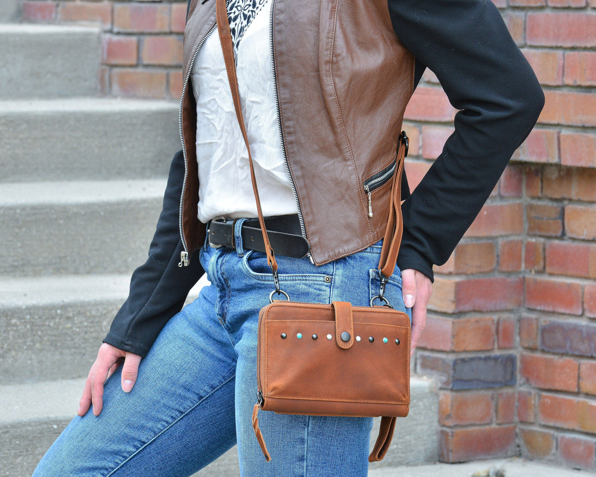 Concealed Carry Millie Leather Crossbody Organizer in Cognac – worn by model