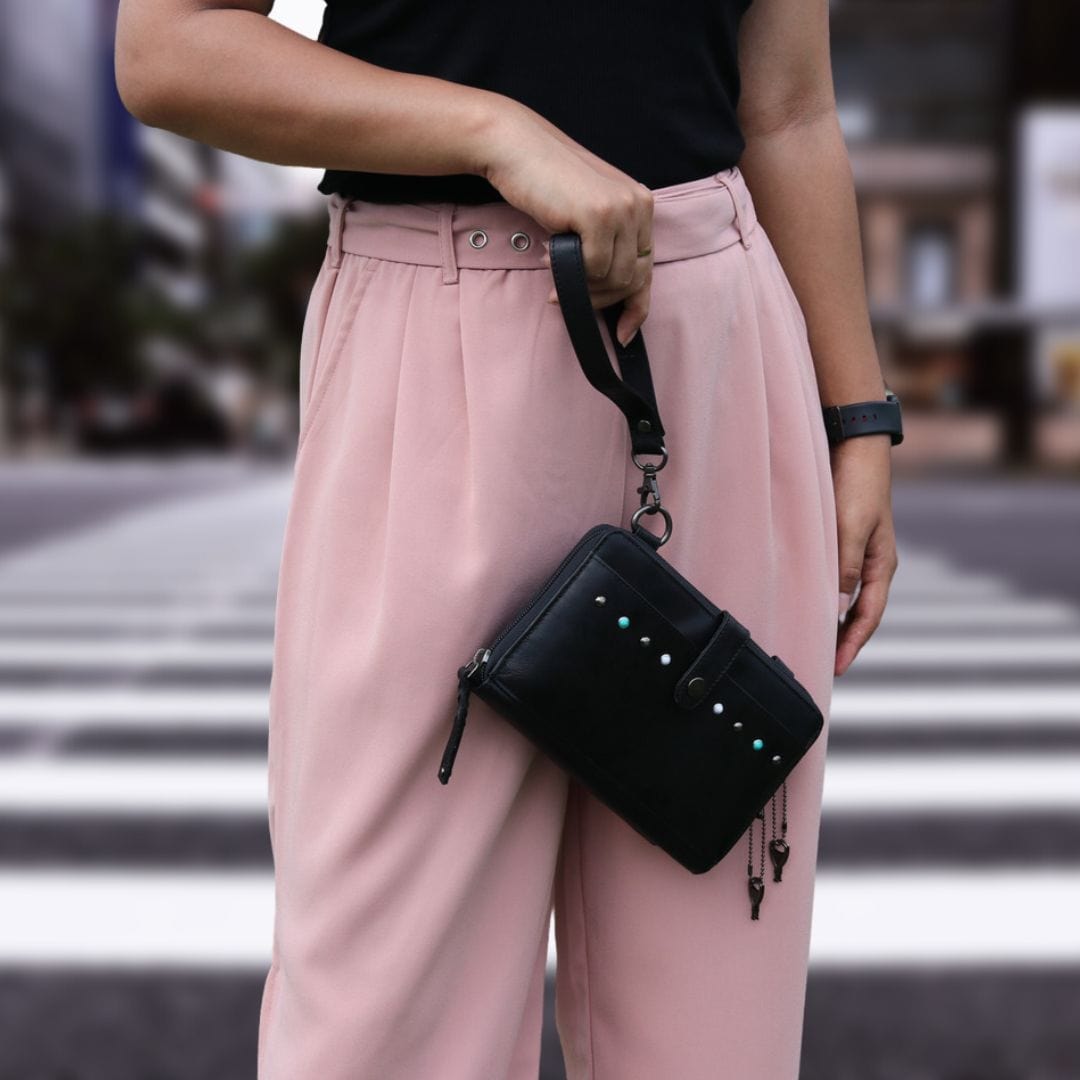 Concealed Carry Millie Leather Crossbody Organizer in Dusty Black – worn by model 2