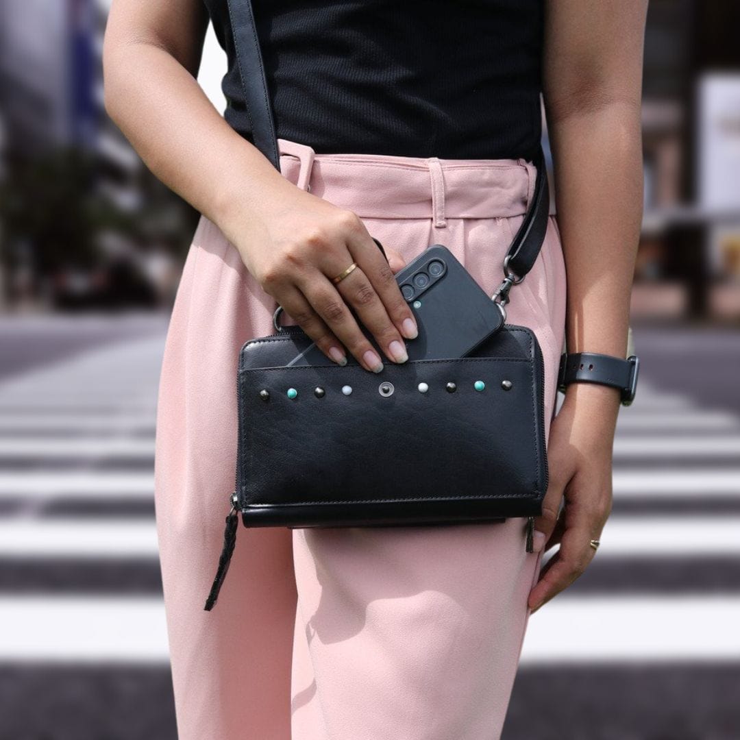 Concealed Carry Millie Leather Crossbody Organizer in Dusty Black – worn by model