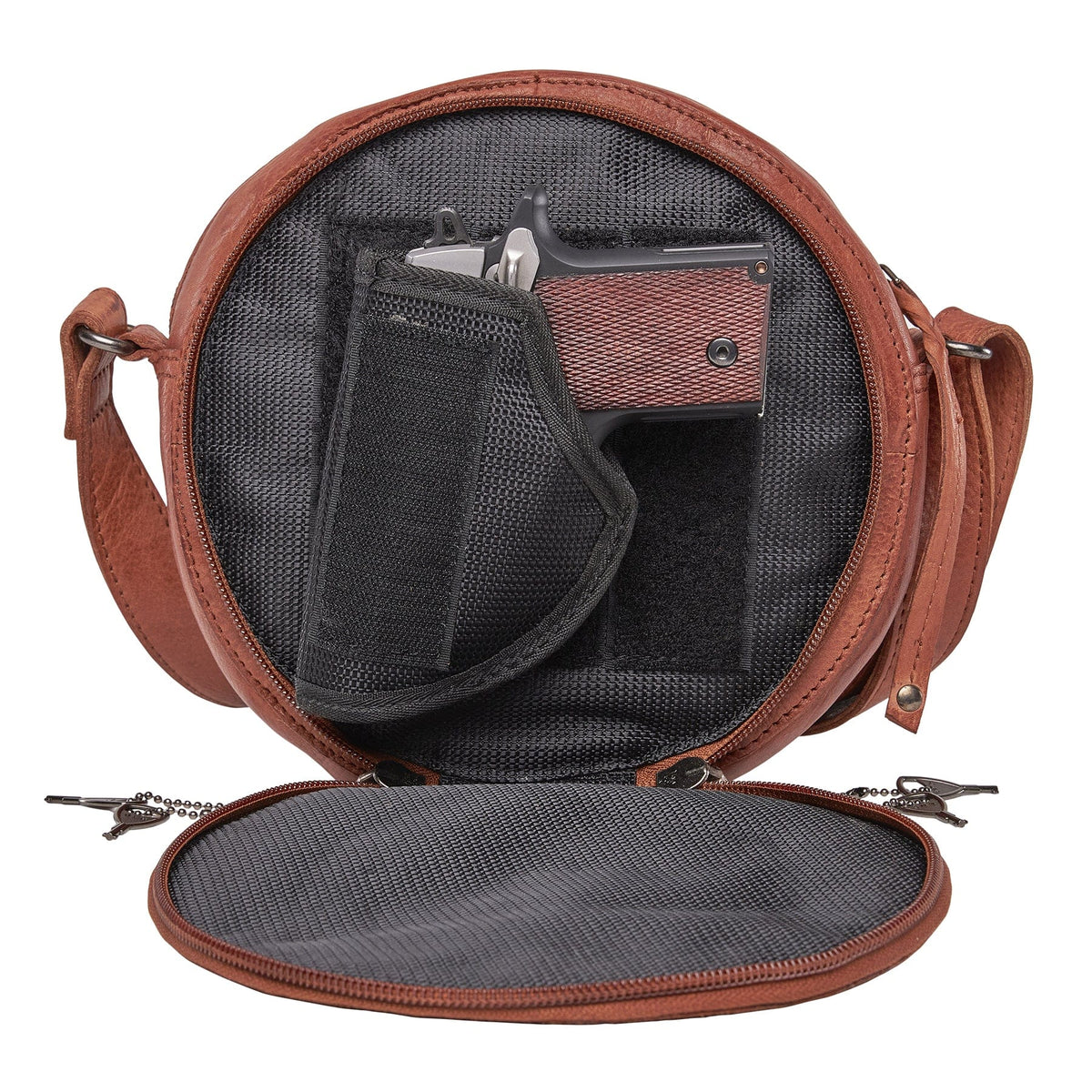 Women's Concealed Carry Mia Crossbody Purse in Cognac – shown with handgun