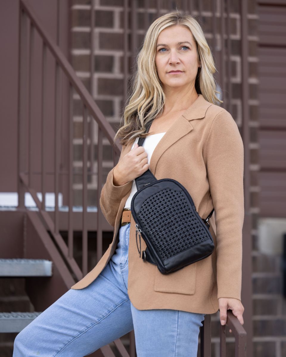 Concealed Carry Bristol Sling Leather Backpack in Black – worn by model 2