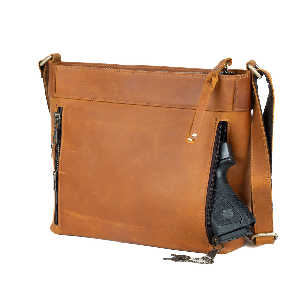 Concealed Carry Delaney Leather Crossbody in Distressed Light Brown – shown with handgun