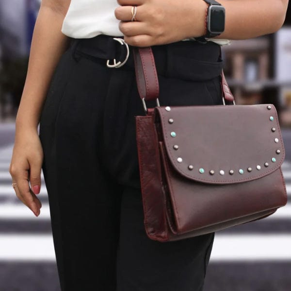 Concealed Carry Raelynn Buffalo Leather Crossbody RFID Organizer in Burgundy – worn by model 3
