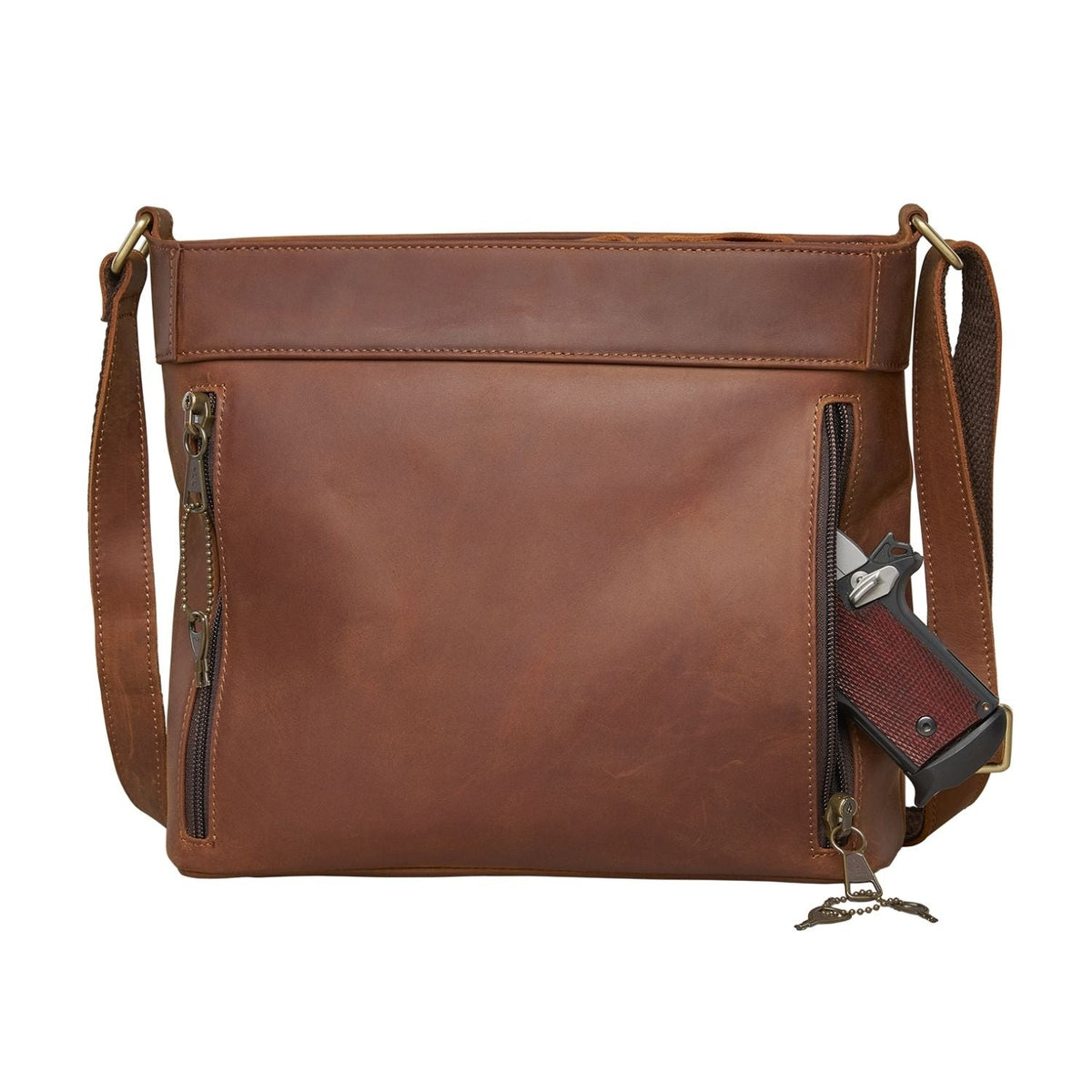 Delaney Concealed Carry Crossbody in Distressed Dark Brown – shown with handgun